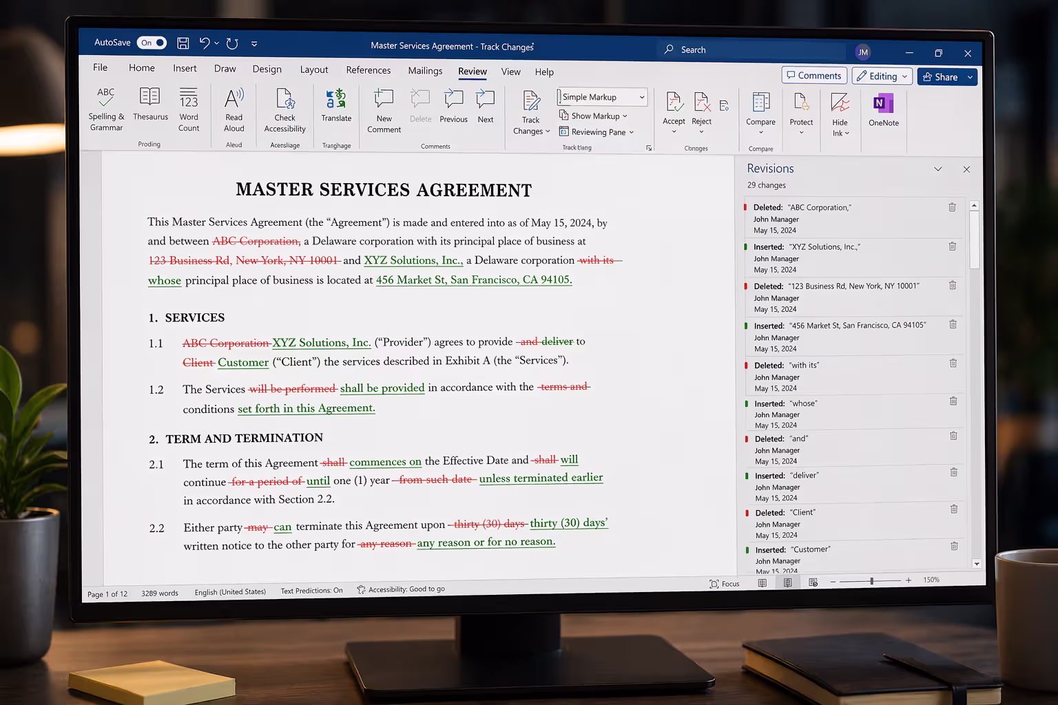 Computer screen displaying a contract document with track changes showing strikethrough deletions and colored additions